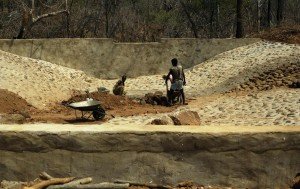 Building pan for creating a permanent water hole